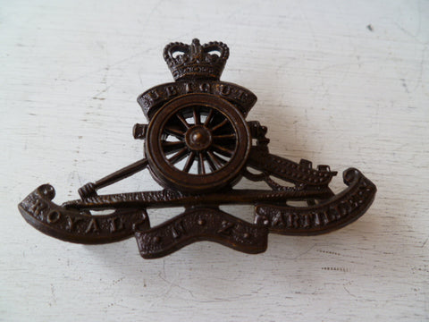 NEW ZEALAND  rnza off cap badge moving wheel  metal bronze
