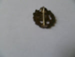 home front and army ATS lapel badge with number on back