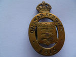 brit on war service badge #12247T  maker wooley